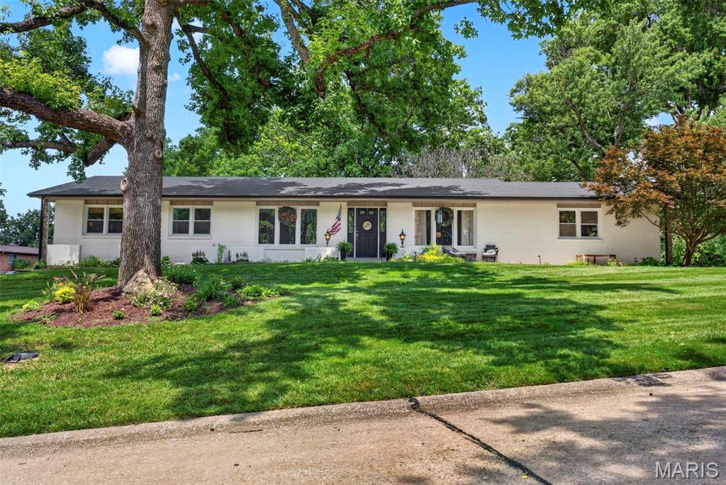 The seller has received multiple offers and has established an offer deadline of 8:00 AM on Monday, July 13, 2026 with a response time of 10:00 am. Completely updated and designed for effortless one level living, this exceptional Chesterfield ranch pairs sophisticated interior updates with one of the most impressive backyards you'll find in all of Chesterfield. The heart of the home is a beautifully renovated kitchen featuring stylish finishes, quality cabinetry, stainless steel appliances, and an open concept design. Expansive, oversized windows flood the home with natural light, enhancing the bright, airy feel throughout while framing views of the private backyard. The luxurious primary suite is equally impressive, highlighted by a stunning, fully remodeled spa inspired bathroom. Thoughtfully updated with newer major mechanical systems, this home offers the peace of mind today's buyers are looking for. Then you step outside.
Situated on a rare corner lot just under half an acre, the backyard feels like a private resort. The jaw dropping custom in ground pool is surrounded by striking stonework that creates an unforgettable focal point, while the mature tree line behind the property provides an exceptional level of privacy rarely found in a neighborhood setting. Unlike many homes with pools, there's still an abundance of level yard remaining—perfect for kids, pets, lawn games, or future outdoor additions. It's a backyard designed for everything from quiet evenings to unforgettable summer gatherings.
The finished lower level provides exceptional flexibility with space for a media room, recreation area, home gym, or guest retreat. Ideally located just steps from Four Seasons Country Club, you'll enjoy easy access to championship golf, tennis, swimming, dining, and one of Chesterfield's premier private club lifestyles. You're also just two blocks from Parkway Central High School and minutes from shopping, dining, and everything that makes Chesterfield one of the region's most sought-after communities. This is a rare opportunity to own a truly move in ready home where luxury, privacy, and an unbeatable location come together.