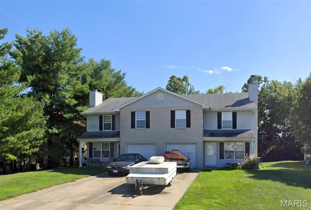 Three Bedroom Duplex in Pine Meadows Subdivision, LVP Flooring Throughout Main Living Areas, 19 x 13 Living Room with Brick Hearth Fireplace, Kitchen Includes Electric Range, Dishwasher, Garbage Disposal and Refrigerator, 15 x 14 Dining Area Walks Out to Back Deck, Main Floor Half Bathroom and Separate Utility Room, Second Floor Provides 17 x 16 Master Bedroom with Double Closet Space and Walk Separate In Closet, Private Master Bathroom, 15 x 11 Second Bedroom, 13 x 13 Third Bedroom, Second Floor Hallway Bathroom, Available Now.