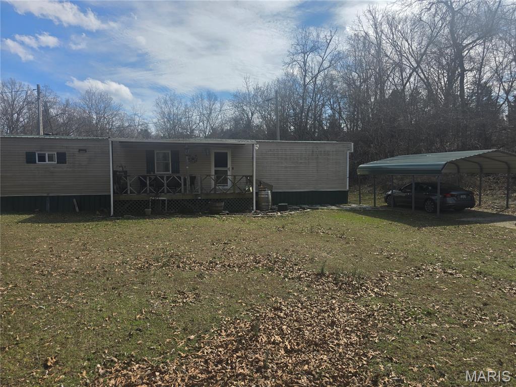 This 4.9 acre property is waiting for it's new owner. There is a 2 bedroom 1 bathroom manufactured home on the property and a Possible 3 bedroom 2 bathroom manufactured home on the property. There are 2 large outbuildings that come with this property. This land is right of the main highway with easy access for travel and still provides the peace of a secluded area. Buyer to do their own due diligence.