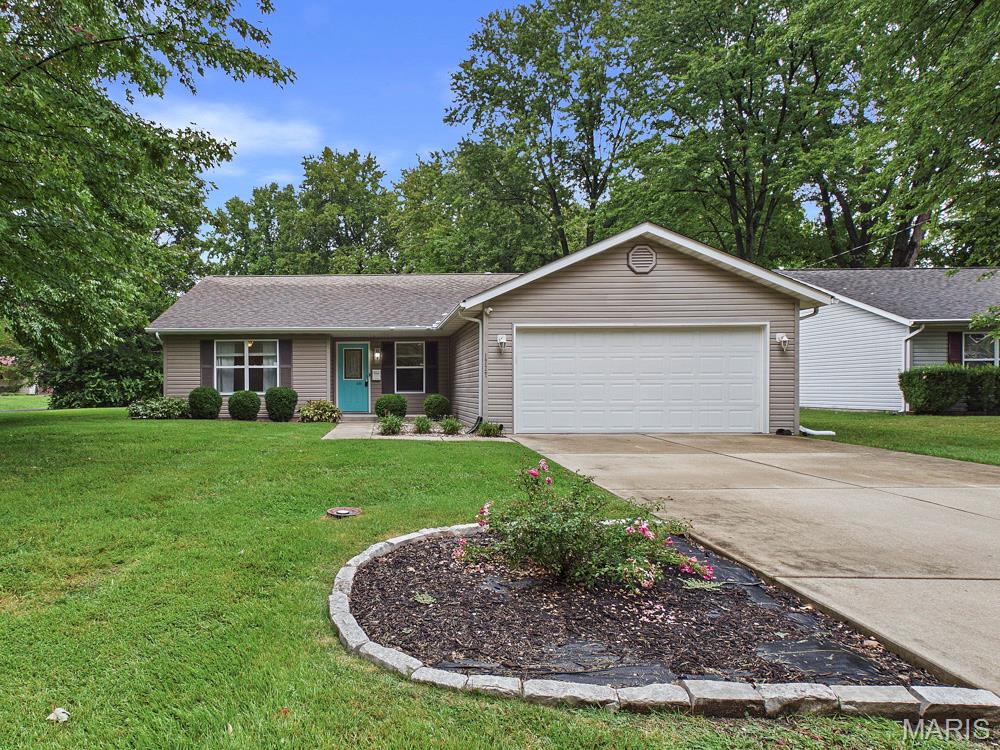 Welcome home to 1727 Laurette Lane! This charming 3-bedroom, 2-bath ranch sits on a desirable corner lot in the popular Adair Gardens neighborhood and offers a comfortable, efficient layout with plenty to love. Step inside to a spacious, open living room featuring a gas fireplace, perfect for cozy evenings at home. The eat-in kitchen offers plenty of space for everyday meals and provides convenient access to the backyard. Down the hall, you'll find two additional bedrooms, a full guest bath, and the primary bedroom featuring double closets and a private full bath with a walk-in shower. Several updates and well-maintained features add extra peace of mind. The water heater was replaced in 2023, and the HVAC system has been professionally serviced every year with maintenance records available. The washer and dryer are approximately 3 years old and are included with the home. Outside, enjoy a large, fully fenced backyard with a patio that's ready for cookouts, entertaining, pets, or simply relaxing outdoors. The 2-car garage also provides additional space for parking and storage. With its functional floor plan, fenced yard, cozy fireplace, recent improvements, and convenient location, 1727 Laurette Lane is ready for its next owner. Schedule your showing today!