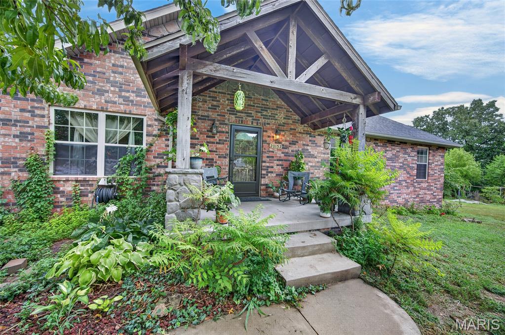 Experience quality craftsmanship in this beautiful custom-built home by Bryan Murray, perfectly situated on approximately 2.78 acres in a quiet cul-de-sac just outside the city limits and located within the highly sought-after Waynesville R-VI School District. Designed with both comfort and entertaining in mind, this spacious home features elegant triple tray ceilings in the living and dining rooms, custom cabinetry, stainless steel appliances, and a beautifully appointed kitchen with newer stainless steel appliances, all replaced within the last two years. The thoughtfully designed primary suite complete with a double vanity, jetted soaking tub, and separate walk-in shower. The finished walkout basement expands your living space with a huge family room, an additional bedroom, and a full bathroom, making it ideal for guests, multi-generational living, or a recreation area. Recent updates include fresh interior paint and brand-new carpet, allowing you to move right in with peace of mind. Two water heaters ensure there's plenty of hot water for family and guests alike. Step outside and enjoy the privacy of the fenced backyard featuring both a patio and covered deck, creating the perfect setting for grilling, entertaining, or simply relaxing while taking in the peaceful surroundings. As an added bonus, the sale includes a large safe and a riding lawn mower, making this exceptional property an even greater value. If you've been looking for a spacious, move-in-ready home with custom finishes, modern updates, acreage, and a peaceful setting just minutes from town, this is one you won't want to miss. Schedule your private showing today!