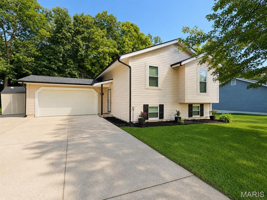 Welcome home to this beautifully updated 3-bedroom, 2-bath home with a finished basement, nestled in a friendly, established O’Fallon neighborhood and backing to the wooded beauty of Fort Zumwalt Park. Thoughtfully updated inside and out, this move-in-ready home features all-new stainless steel kitchen appliances, continuous LVP flooring, updated lighting, two fully remodeled bathrooms with all-new finishes and fixtures, refinished stairs, and a new guard railing. The finished basement offers flexible additional living space perfect for a family room, playroom, home office, gym, or entertaining. Outside, enjoy a new roof, fenced backyard, new deck, refreshed landscaping and flower beds, retaining wall, rock garden, new shutters, and mailbox. The wooded backdrop of Fort Zumwalt Park provides beautiful views and added privacy, while the park’s lights create a magical setting during the holidays. Located near a cul-de-sac where neighbors gather, this welcoming home combines extensive updates, flexible living space, and a wonderful neighborhood setting.