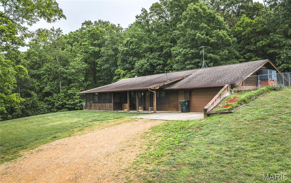 Discover your own private hunting retreat and family homestead on this stunning 61-acre property in Marblehill, Missouri! This charming three-bedroom, two-bath basement home offers comfortable country living with central heat and air plus a cozy outside wood fireplace—perfect for crisp fall evenings and entertaining.
The land is a hunter’s and nature lover’s paradise, featuring mature timber, several strategically placed tree stands, and multiple food plots that attract abundant wildlife including deer, turkey, and squirrels. Two scenic ponds enhance the property’s beauty and recreational potential, while a network of trails winds throughout for easy access by foot, ATV, or UTV. Ponds are stocked with bass and catfish.
Additional features include a large shop building for projects or storage, three carports offering versatile covered space for vehicles, equipment, or workshops, plus dog pens and chicken coops already in place for those wanting to raise animals.
Just minutes from Marblehill and a short drive to Jackson and Cape Girardeau, this property delivers peaceful rural living with convenient access to amenities. Whether you’re seeking a primary residence, weekend getaway, or investment hunting property, this turnkey slice of Missouri countryside is ready for you!
Don’t miss your opportunity to own a piece of paradise—schedule your private showing today.