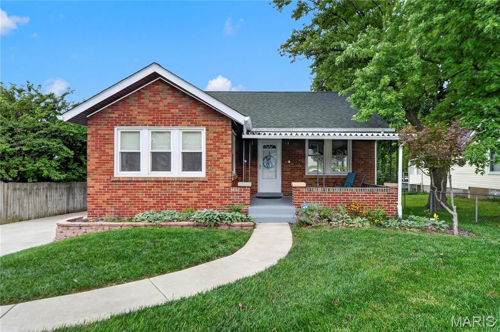 Charming brick bungalow filled with updates and classic character. This move-in-ready home offers a new roof with ridge vent scheduled for installation in mid-August, a newer 200-amp electrical panel, new laminate flooring, and newer windows. Inside, you’ll appreciate the 8.5-foot ceilings, hardwood floors, and a refreshed all-white kitchen with a new microwave. The large, fenced lot provides great outdoor space, and the basement includes a second bathroom and a recreation room.