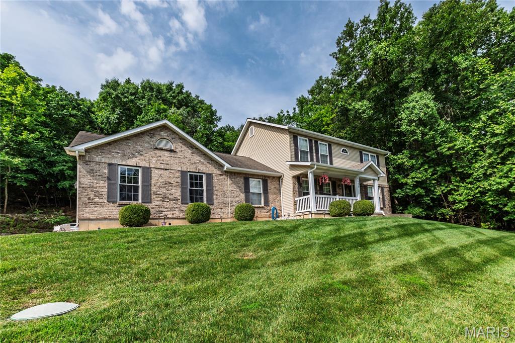 Spacious 2-story home situated on 1.5 acres with public water and sewer! This well-maintained property features 3 bedrooms, 3 full baths, and a 2-car garage. The inviting floor plan offers a large great room, formal dining room perfect for family gatherings, and a spacious kitchen with abundant counter space, pantry, and adjoining breakfast room. Convenient main-floor laundry and a private office/den that could serve as a guest or sleeping room provide added flexibility. The breakfast room walks out to a small, secluded patio overlooking the private backyard. Enjoy year-round comfort with a zoned HVAC system. The full basement offers endless potential for future living and entertaining space. Ideally located near Byrnes Mill Park and the river, providing easy access to outdoor recreation while maintaining a peaceful country setting. Don't miss this opportunity to own a spacious home with room to grow!