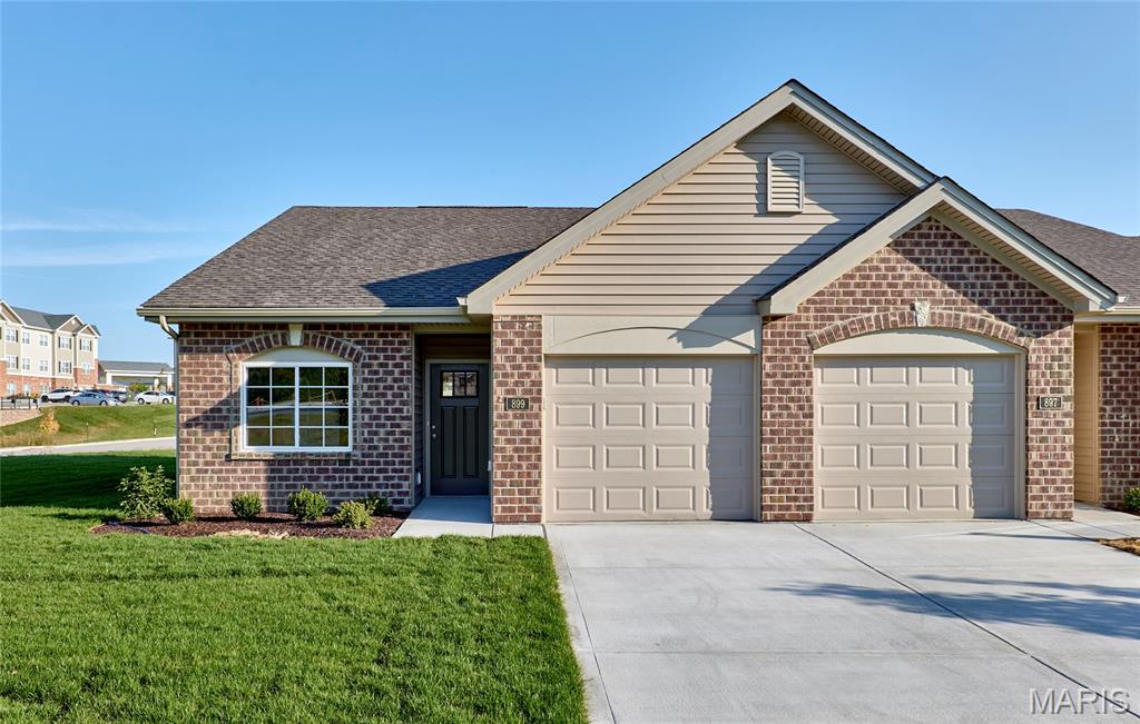 Impressive 2 bedroom, 2 bath, low maintenance villa in picturesque Washington, by Bridgewater Communities, your villa experts!  Bridgewater Communities present their Cottage Villa Collection of homes, designed to be high functioning, on-trend and focused on convenience and smart use of space.  Intentionally designed as a single cul de sac street, there is only one way in and out for privacy and safety.  This end unit villa features a low maintenance exterior with brick, vinyl siding, 30 year architectural shingles, a 14x8 expanded patio, oversized 1 car garage with 9 ft wide garage door, garage coach lights and a low threshold entry for a no-step entry!  Features include 9 foot ceilings throughout, an open floor plan, all electric home, wide hallways and interior door openings, Kitchen island with seating bar, coffee bar, roll out shelving, 36 inch tall Kitchen cabinets, luxury vinyl plank flooring (everywhere except bedrooms), upgraded carpet and pad in the bedrooms, stainless steel appliances, microwave-dishwasher-smooth top stove, Quartz countertops, walk in pantry, under cabinet lighting, composite Kitchen sink, ceiling fans in Primary Bedroom and Living Room, raised height vanities with drawer stacks in both baths, medicine cabinet in the Primary Bath, shower with seat in the Primary Bath, walk in closet in the Primary Suite, 5.25 tall base trim, transoms windows in the Dining and Living Room area and more.  A monthly fee covers lawn care, landscape maintenance, snow removal (per indentures) and more. Enjoy this convenient location off High Street just South of Highway 100 in Washington.  Quality, value and elegance! This home is scheduled for a late 2026 completion.