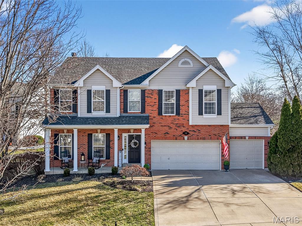 Impressive two story home with 2,587 sq ft of amazing living space in the desirable Sommers Landing neighborhood! The exterior is eye-catching with brick, vinyl siding, architectural shingles, 3 car garage, coach lights and a large covered front porch. This home sits on a large (.31 Acres) homesite with a level backyard, composite deck with vinyl railing, firepit area, mature trees, lawn irrigation, and spectacular seasonal landscaping. Features include 9 foot ceilings on the main, 6 panel doors, Laminate Wood floors throughout the main, formal dining room, gas fireplace, window wall in Great Room, updated kitchen (2020), granite countertops, tile backsplash, under cabinet lighting, wine fridge, coffee bar, stainless steel appliances, island with seating bar, and main floor laundry with built in cabinetry. Upstairs you will find a loft with a walk-in closet, 3 bedrooms all with walk in closets, spacious Primary Bedroom Suite with a large walk-in closet, Primary Bath with double bowl vanity, linen closet, separate shower and jetted tub. There is a service door in the garage for easy backyard access.  Additional updates include Water Heater new in 2025, upstairs carpet replaced in 2024, new tile flooring in upstairs bathrooms (2019), and recently updated ceiling fans and light fixtures throughout. Ring doorbell, workbench in basement and peg board stay with the home. There is a neighborhood fishing pond for residents to enjoy. There is easy access to Hwys 70, 40/61, 364, schools, shopping, restaurants, parks, services and more. Stunning home, spectacular backyard oasis, desirable schools, so much to love!