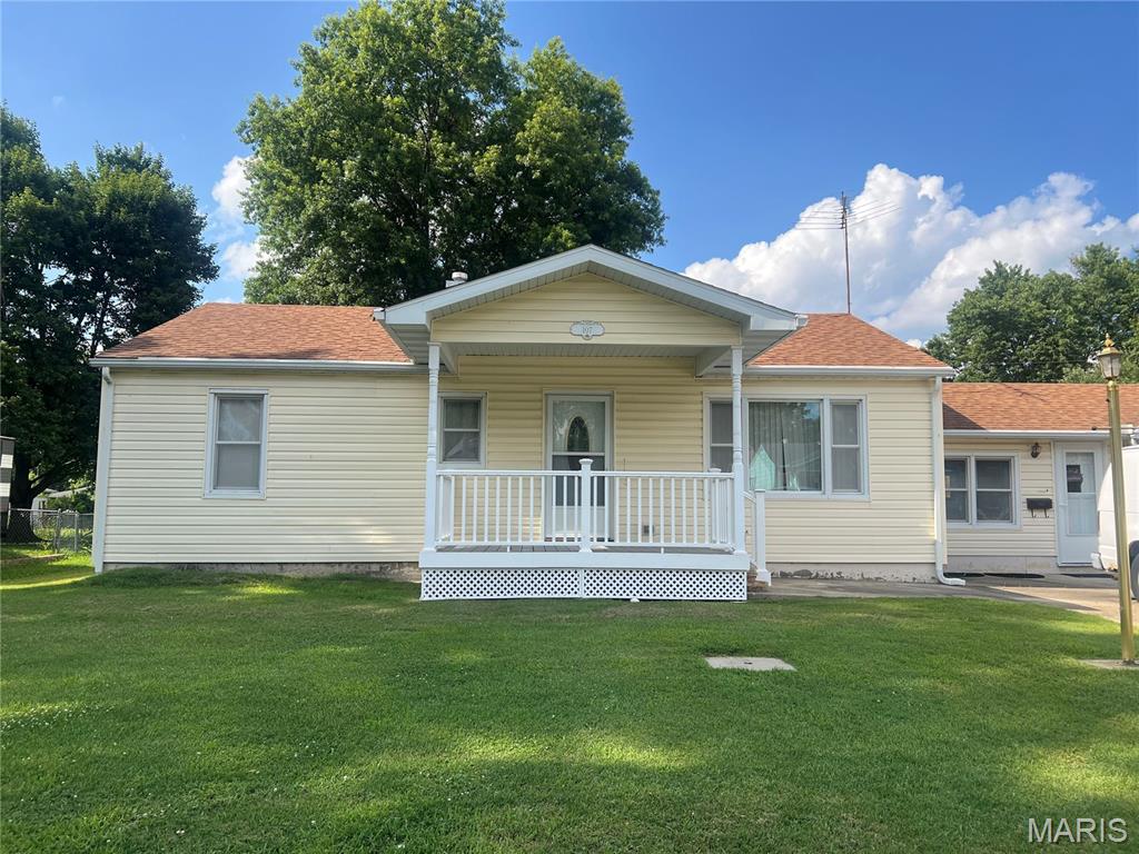 Welcome home to this charming 2-bedroom, 1-bath residence situated on a spacious 0.32-acre lot on the quiet edge of Mount Olive. With a large, grassy backyard, there's plenty of room to relax, entertain, garden, or enjoy outdoor activities. This well-maintained home offers an attached garage complete with a built-in workbench, plus three storage sheds that provide ample space for tools, lawn equipment, hobbies, and seasonal items. The inviting front porch was updated in 2023, creating the perfect spot to enjoy your morning coffee or unwind in the evening. Inside, you'll find a kitchen that was remodeled less than 10 years ago and features updated appliances. Even better, all appliances stay with the home, making your move simple and convenient. A new furnace adds peace of mind and year-round comfort. Full unfinished basement with a toilet, sink and shower and ample room for storage. Located on a quiet street at the edge of town, this move-in ready home combines small-town charm with practical updates and abundant storage. Whether you're a first-time homebuyer, looking to downsize, or searching for a place to make your own, this property is ready to welcome you home.
