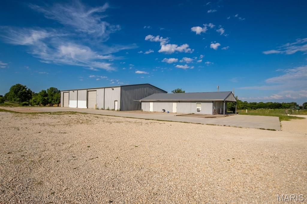 Looking for commercial space for lease in Jonesburg, Missouri with easy interstate access, room to grow, and flexible business potential? This commercial property on Oak Hill Road offers a rare opportunity to lease a versatile setup in one of the most convenient locations along the I-70 corridor.

The property features a 6,000+/- square foot industrial/commercial building with two large 16-foot overhead doors, making it ideal for contractors, construction companies, equipment storage, trucking operations, service businesses, distribution, warehouse use, manufacturing, agricultural support businesses, and a variety of commercial applications. The building offers the space and functionality businesses need while maintaining excellent accessibility for employees, customers, vendors, and deliveries.

Also available is an approximately 1,400+/- square foot office building, providing a professional environment for administrative operations, sales teams, client meetings, management offices, or business headquarters. The combination of warehouse/shop space and office space creates an efficient setup for companies seeking both operational and administrative facilities in one location.

Situated on approximately 3 acres, the property includes a large gravel parking lot and yard area, offering ample room for employee parking, customer access, equipment staging, fleet vehicles, trailers, material storage, or outdoor operational needs. The generous outdoor space provides flexibility that is increasingly difficult to find in today's commercial leasing market.

Location is a major advantage. Positioned just minutes from Interstate 70, this property provides convenient access to Jonesburg, Warrenton, Wright City, Montgomery City, Wentzville, St. Charles County, and the greater St. Louis metropolitan area. Businesses serving eastern Missouri will appreciate the central location and excellent transportation access.

Property Highlights:
• 6,000+/- SF commercial/industrial building
• Two 16-foot overhead doors
• Approximately 1,400+/- SF office building
• Approximately 3 acres
• Large gravel parking lot and yard area
• Excellent access for trucks, trailers, and equipment
• Convenient I-70 location
• Central Missouri service area
• Ideal for contractors, warehouse, distribution, logistics, construction, service companies, equipment storage, manufacturing, and commercial operations

Opportunities like this are hard to find in the Jonesburg and Warren County area. Whether you need warehouse space, shop space, contractor headquarters, equipment storage, distribution space, or a combination of office and industrial facilities, this property offers the location, flexibility, and functionality to help your business succeed.

Commercial space for lease in Jonesburg, MO. Warehouse for lease near I-70. Industrial building for lease in Warren County. Office space and shop space available with easy access to Warrenton, Wright City, Montgomery City, and the St. Louis region.

Contact today for lease terms, availability, and a private tour.
