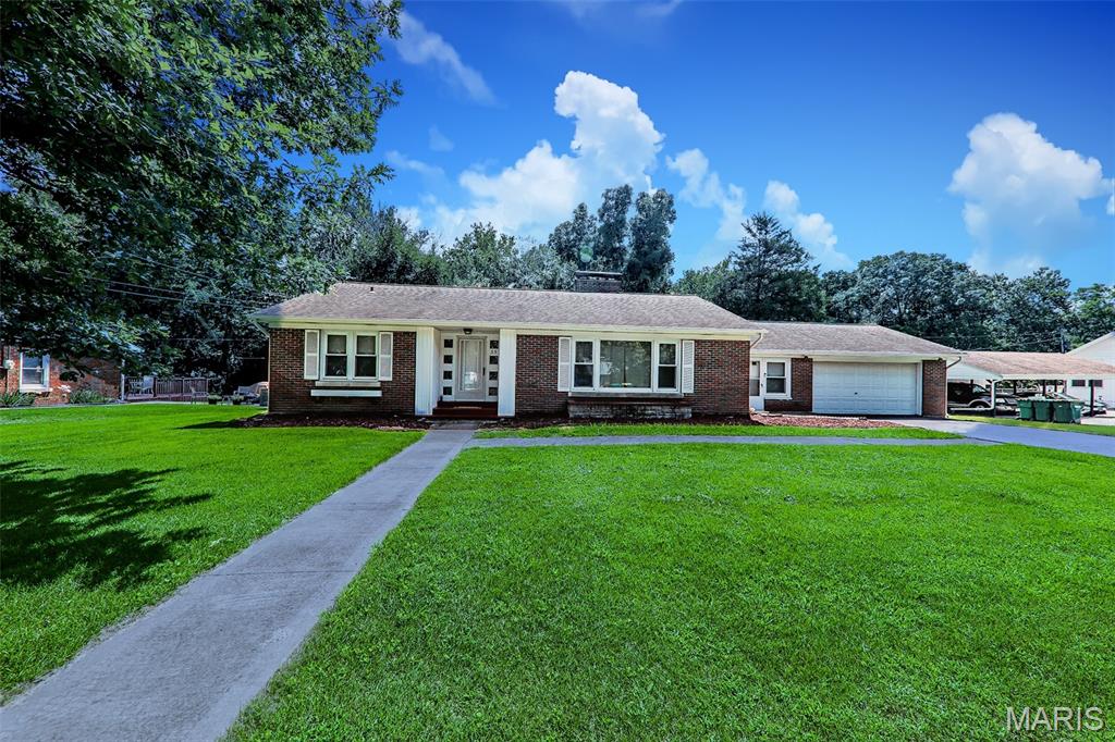 Experience the welcoming charm of 35 Harmon DR. Ready to move into and designed for comfortable living. This inviting home offers a seamless blend of classic appeal and modern conveniences, promising a delightful everyday experience. The heart of this home, the kitchen, is equipped with sleek stainless steel appliances, providing both style and functionality for culinary endeavors. Adjacent, the living room offers a comforting ambiance, centered around a fireplace – perfect for intimate gatherings or quiet evenings at home. With four bedrooms and two bathrooms, this residence provides ample space. One of the bathrooms features a convenient walk-in shower, adding a touch of modern ease. An attached garage offers practical utility and direct access. Discover the effortless living offered by this ranch-style home, a perfect setting for creating lasting memories. Walking distance to McKendree College. Home has passed city occupancy. Move right in. Call for your private appointment today to see this ready-to-move-in home.