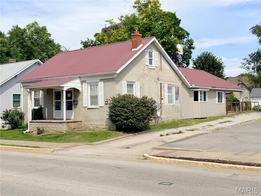 Historic Millstadt property offering approximately 2,006 square feet of living space on a .23-acre lot, awaits your arrival. This property combines the character of the original masonry home with a substantially later addition providing an exceptionally large and versatile open living area. The spacious addition features an open kitchen with abundant cabinetry, center island, recessed lighting, multiple ceiling fans, mini-split climate control and an impressive amount of open floor space. Main floor laundry and a newly installed walk-in shower are featured in oversized full bath while the other bathroom located also on the main floor features a deep soaking tub to enjoy after a hard day. Large windows provide natural light, while French doors lead directly to an expansive covered patio—creating excellent indoor/outdoor living and entertaining possibilities. Outside, the property offers a fenced yard, covered patio, off-street parking and a convenient in-town Millstadt location. With its unusually flexible floor plan and expansive gathering space, this is a property that deserves a closer look. With TLC, whether used for traditional residential living or adapted to meet a buyer's particular needs, 110 N Jefferson offers space and possibilities that are difficult to find in a typical home.   Zoning options make this property even more attractive.   Property has passed occupancy inspection.