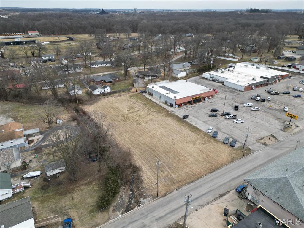 LOCATION, LOCATION, LOCATION with a traffic count of approximately 1,750 per day!!!!   Prime .89 ac +/- vacant commercial lot located in the heart of town, just a short walk from local schools.  With its unbeatable location, this lot offers incredible potential for a new business that can contribute to the growth of our expanding community.  Ideal for enterpreneurs looking to establish themselves in a high-traffic area, ready to thrive in a town on the rise! Location: City