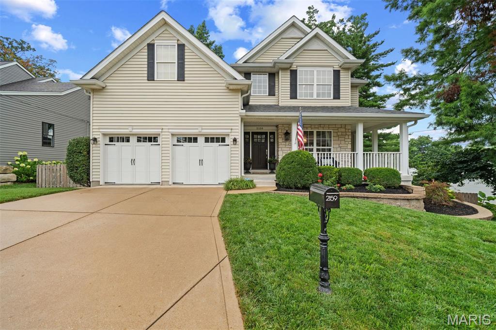 This beautifully designed newer home offering the perfect blend of style, comfort, and functionality in the highly sought-after Ladue School District. An inviting covered front porch creates a warm first impression, while the thoughtfully designed floor plan is ideal for today's lifestyle. The main level features a formal dining room, a large kitchen with island, breakfast room that opens to a deck, spacious family room, laundry room, and a powder room. The upper level features four spacious bedrooms and two full baths, including a serene primary suite. The finished walkout lower level expands your living space with a large recreation room, fifth bedroom, full bath, and abundant storage and opens to an inviting outdoor area. Step outside to enjoy the beautifully landscaped backyard, where a cozy patio with an outdoor fireplace creates the perfect setting for relaxing evenings, outdoor dining, and year-round gatherings. Ideally located just minutes from area amenities, this exceptional home combines newer construction with an unbeatable location in one of St. Louis' most desirable communities.