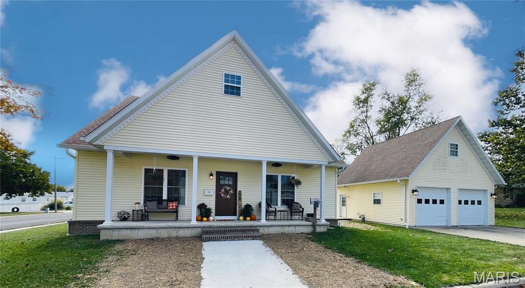 This stunning, nearly-new construction home is an entertaining dream! Beautiful interior spaces and fun areas outside for hosting family and friends. Inside the home find engineered HARDWOOD FLOORS, a stone hearth surrounding the GAS FIREPLACE, open living area, WET BAR, and a CUSTOM KITCHEN with large center island, walk-in pantry, and quartz countertops. You'll enjoy a lovely MAIN LEVEL LAUNDRY ROOM with dual closets and deep sink, a hall POWDER ROOM, and gorgeous MAIN LEVEL PRIMARY SUITE with an amazing walk-in closet and spa-like bathroom. The 1600 SQ. FT. UNFINISHED BASEMENT has 10-ft poured walls, an egress window and stubbed in plumbing for another bathroom. Other amenities include a WELCOMING FRONT PORCH and COVERED BACK PORCH, outdoor BBQ BAR as part of the 10'x28' CLUBHOUSE/WORKSHOP, and a GARDEN SHED for additional storage. The 2-CAR DETACHED GARAGE has a TIKI BAR at the back and a 1-bedroom STUDIO GUEST SUITE on the upper level with kitchenette and full bathroom (**including house and the guest suite, property totals 4 bedrooms, 3 full bathrooms and 1 half bathroom, with potential for additional bedroom and bathroom in the basement).