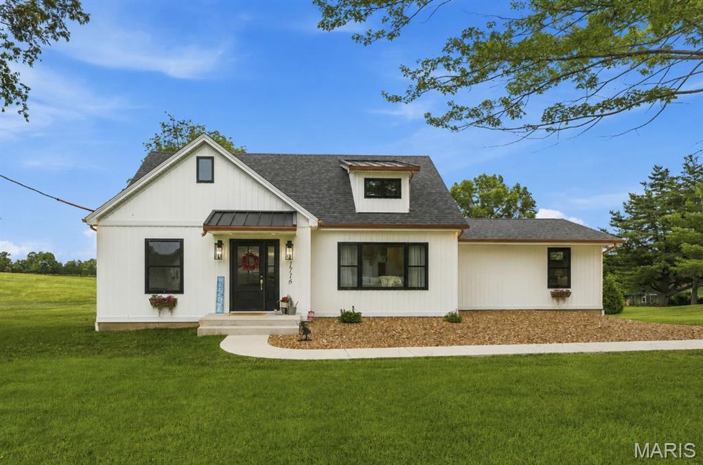 Some homes simply check the boxes. Others completely change the way you live.

Welcome to 1716 Pottery Road, where modern updates, peaceful pond views, and exceptional flexibility come together on nearly half an acre just minutes from Washington.

Thoughtfully renovated from top to bottom, this 4-bedroom, 3.5-bath home offers over 2,700 square feet of beautifully designed living space with an open floor plan, soaring ceilings, custom finishes, and abundant natural light throughout. The gourmet kitchen is the heart of the home, featuring custom cabinetry, quartz countertops, an oversized island, walk-in pantry, stainless appliances, and seamless access to the dining area and maintenance-free deck overlooking the pond.

The spacious main-floor primary suite provides a private retreat with a spa-inspired bath featuring a soaking tub, oversized tile shower, double vanity, and walk-in closet with built-in storage. A second bedroom on the main level offers flexibility for guests, a nursery, or a home office. A beautiful main-floor laundry room offers a welcoming space designed with function and peace in mind. The original wood doors frame out the attention to detail for the laundry room and a walk-in, generously sized pantry. Every improvement was made with purpose, combining exceptional craftsmanship, timeless aesthetics, and everyday functionality to create a home that's as enjoyable to live in as it is beautiful to own.

Upstairs, you'll find two additional bedrooms, a full bath, a loft/flex space with a beautiful window bench, and a second laundry room upstairs, creating exceptional convenience for family living.

The walk-out lower level offers tremendous storage and future finishing potential while providing direct access to the attached garage.

One of this property's most unique features is the detached workshop/garage complete with electric, workbenches, and incredible versatility—perfect for woodworking, hobbies, classic cars, a home business, fitness space, or additional storage.

Outside, enjoy peaceful pond views, mature landscaping, and a private backyard that feels like country living while remaining just minutes from shopping, restaurants, schools, and Highway 100.

Beautifully updated, thoughtfully designed, and offering features rarely found together, this is more than just a home—it's a lifestyle.
