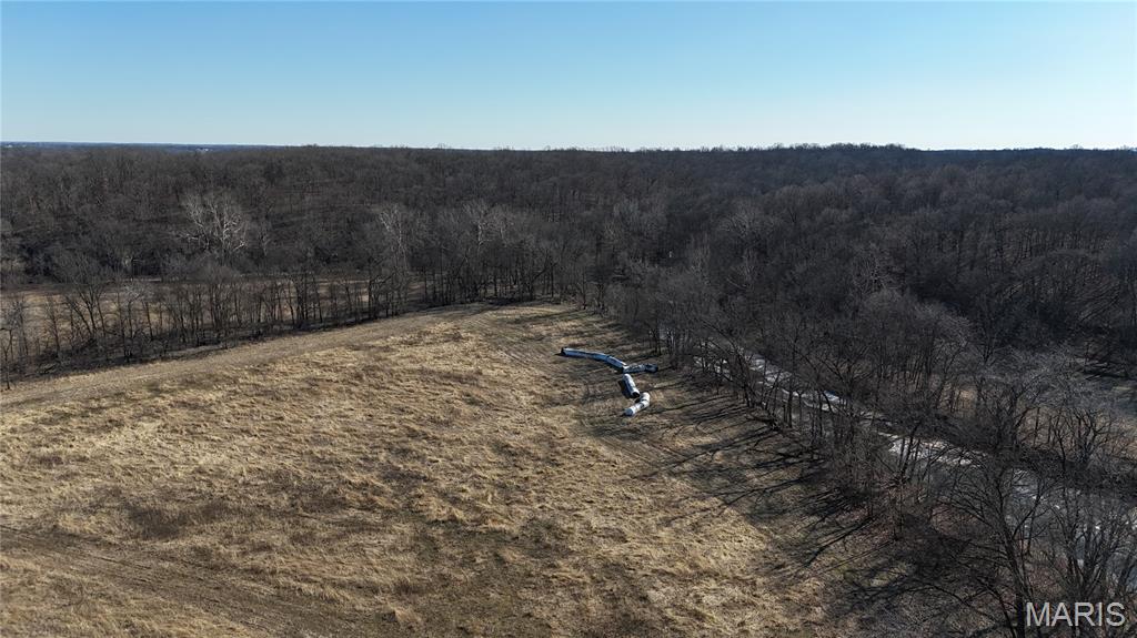 Discover the perfect blend of productive farmland and recreational opportunity on this beautiful 53+/- acre tract in Lincoln County. Approximately 15+/- acres are tillable, offering excellent potential for farming income, food plots, or future agricultural use. The remainder of the property features gently rolling terrain with a desirable mix of open ground and natural cover, creating an ideal setting for outdoor enthusiasts. The land provides outstanding wildlife habitat with frequent sightings of whitetail deer and wild turkey, making it a prime location for hunting and recreation. Established fruit trees enhance the property’s food plot potential and further attract and sustain local wildlife. Several attractive building sites are scattered throughout the property, offering scenic views, privacy, and flexibility for a future home, cabin, or weekend retreat. County road frontage provides convenient access while preserving the quiet atmosphere of rural living. Whether you’re seeking tillable acreage, recreational land, or the perfect place to build your dream getaway, this versatile Lincoln County property offers endless possibilities and truly checks all the boxes.
