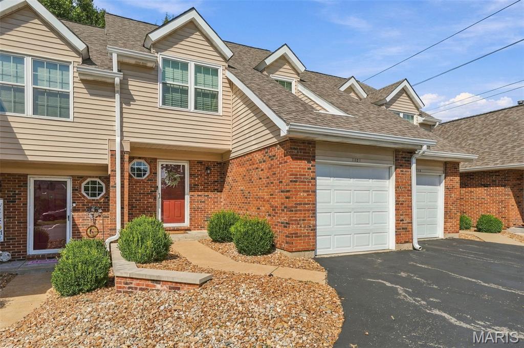 Welcome to this beautifully updated townhouse, combining comfort, style, and modern updates in a highly desirable community. The light-filled living room makes a striking impression with its vaulted ceiling and open loft overlooking the main level, creating an expansive feel and seamless flow throughout the home. The updated kitchen features beautiful cabinetry, granite countertops, and stainless-steel appliances, while offering convenient access to the attached covered garage, providing protection from the elements year-round. The dining room opens to a private deck, the perfect retreat for morning coffee, outdoor dining, or relaxing under the stars. Additional main-level features include an updated powder room, a generous entry closet, and a stackable washer and dryer for added convenience. The primary ensuite bedroom is enhanced by vaulted ceilings and a beautifully updated private bath featuring granite countertops, a double vanity, custom cabinetry, and a tub/shower combination. A second bedroom and an additional full bath complete the upper level. The unfinished basement provides abundant storage space and includes a second laundry area with a full-size washer and dryer, offering exceptional flexibility and functionality. Enjoy outstanding community amenities, including a swimming pool, clubhouse, tennis courts, and pickleball courts, making it easy to enjoy an active and social lifestyle. With stylish updates, versatile living spaces, and exceptional community amenities, this move-in-ready townhouse is ready to welcome you home.