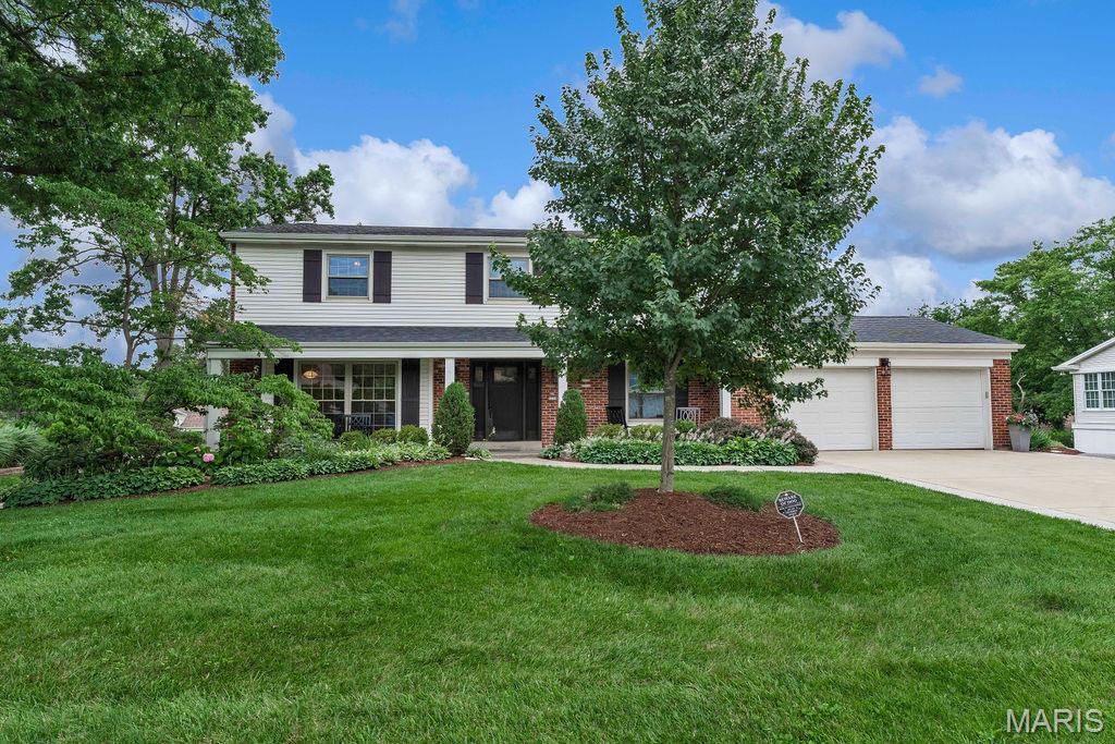Incredible all-brick 2 Story on amazing lot with new roof and tons of updates in sought-after Kirkwood location! 4 bedrooms, 3.5 bathrooms, 3,463 sqft, on over a third of an acre and an oversized 2-car garage. Newer driveway with stamped concrete border and sidewalk leads to covered front porch and new entry door. Large office features hardwoods, floor to ceiling windows, and crown molding and is flanked by the dining room with crown and pocket door to updated kitchen featuring 42in cabinets, granite, custom backsplash, crown molding, ceramic flooring and recessed lighting. Main floor laundry complete with custom Closet Factory built-ins, granite bench and stackable washer/dryer that stay. Powder room with wainscoting and pedestal sink. Cozy living room with functional wood burning fireplace, brick mantle, built-in cabinets and bookshelves, and crown molding opening to amazing screened-in porch overlooking backyard. Spindled wood staircase to upper level with hardwood floors. Primary suite includes dual custom Closet Factory closets, raised vanity with granite counter, ceramic floors and shower surround. Three additional large bedrooms and updated hall bathroom. Spindled stairwell leads to updated walk-out lower level with ceramic tile floors, recessed lighting, family and rec room featuring kitchenette, bar area with granite counters and French doors opening to stamped concrete patio, level yard, beautiful landscaping with wrap around driveway. Full bathroom with subway tile shower and ample storage. New gutters, gutter guards and roof (2025), excellent Kirkwood schools and location!
