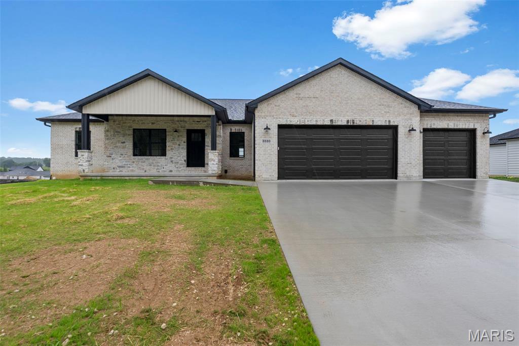 Beautiful new construction home featuring 4 bedrooms, 3 bathrooms, and a 3-car garage! Step inside to an open floor plan with a stunning vaulted wood ceiling and cozy electric fireplace in the living area. The custom kitchen offers quartz countertops, custom cabinetry, and a pantry. Engineered wood flooring runs throughout the main level, adding warmth and style.

The primary suite includes a large walk-in closet and a custom tiled shower designed for comfort and luxury. The finished basement adds approximately 1,000 square feet of additional living space, perfect for entertaining and relaxing. 

Enjoy outdoor living on the composite deck, plus a John Deere room complete with an overhead door and opener for extra storage and convenience. Don't miss your chance to make this beautiful home yours!
