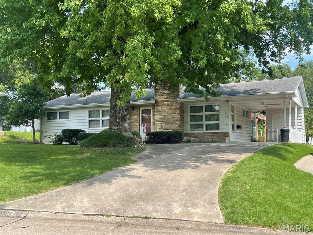 CONVENIENT LOCATION, WONDERFUL CURB APPEAL, LARGE PRIVATE BACK YARD!  This frame ranch with stone trim and fireplace has hardwood floors under all carpet and has updating potential for either an investor or a handy homeowner, although is is liveable as is.  Family room and 2nd bath is in the basement.  Roof is 11 years old, newer stainless refrigerator.  Sellers grew up in the home but have not lived there since their teen years, so disclosure is limited to information they have.  Property is priced and being sold in as-is condition.