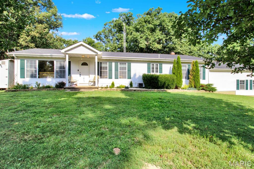 Discover the space, privacy, and versatility of this 3-bedroom, 3-bath home situated on approximately 6.62 acres just minutes from Rolla. With more than 2,400 square feet of living space, this property offers exceptional views form the rear deck for georgeous sunsets and plent of privacy.
Enjoy your own private swimming pool, a brand-new deck, two fenced backyard areas, and plenty of acreage for recreation; pets, hobbies, gardening, or simply enjoying the outdoors. Multiple storage buildings: Including  1 car detached garage and outbuilding(can be converted to horse barn, or provide additional space for tools, equipment, lawn gear, recreational items, or workshop needs. Both have concrete flooring and electric. 
Inside, the home offers a comfortable and functional layout with three bedrooms, three bathrooms, generous living areas: possible office space, dinning room, Kitchen and family room with wood burning fireplace and comfortable living room. (lower level has plenty of space for additional beedrooms, full-bath & laundry is already there and storage area. A mudroom, and flexible spaces that can adapt to work-from-home, family, or hobby needs.
Several major improvements have already been completed, including roofs that are approximately one year old, an A/C system approximately three years old, and the new outdoor deck—helping reduce some of the major ownership expenses buyers often face after purchasing a home.
Located approximately 8 miles from Rolla, Dollar General within 200' , so this property offers the convenience of being close to shopping, dining, employment, healthcare, and everyday services while still providing the space and privacy of country living.
Looking for a ini-farm - this is it: has a large chicken coop, large garden area, childrens play area (including outdoor play set), and a fenced backyard.
6.62 Acres • 3 Bedrooms • 3 Bathrooms • 2,400+ Sq. Ft. • Private Pool • New Deck • Two Fenced Yards • Multiple Outbuildings • Newer Roofs • Newer A/C • Approximately 8 Miles From Rolla