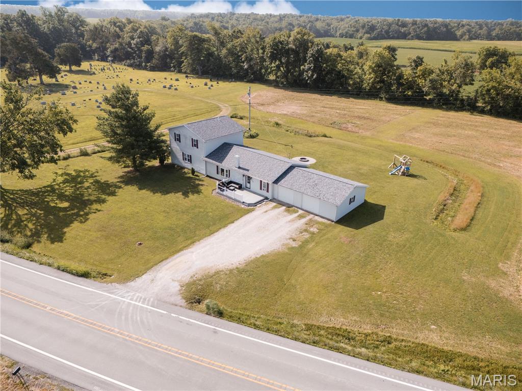 Modern updates meet country living in this beautifully updated 1.5-story home on 5 acres, just minutes from town!
You'll love the spacious primary suite featuring a luxurious walk-in shower with dual shower heads and Bluetooth speakers for a spa-like experience. The home's neutral color palette creates a bright, timeless feel, while the composite front and back decks offer low-maintenance outdoor living.
Step outside to enjoy the thoughtfully designed fire pit area—for relaxing evenings with family and friends.