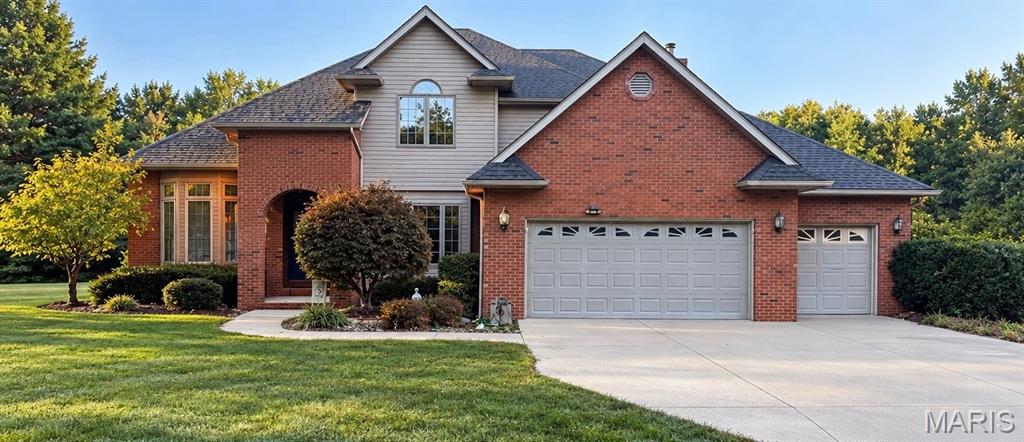 FOX WOODS - GODFREY - Welcome to this spacious 4-bedroom, 2.5-bathroom home, offering a perfect blend of privacy, functional design &  incredible potential! Nestled in a serene and private setting, this property boasts a great floor plan and key structural updates already completed, including a new roof 2023, HVAC system 2014, outside unit heat pump 2024 and a brand-new water heater September 2026. While the home may be in need of some updates and landscaping, it offers a fantastic canvas to customize and build immediate equity. The property is being sold  AS-IS. The Main Floor offers a Formal sitting and dining room combination separated by decorative columns, perfect for hosting guests. The Heart of the Home has a large eat-in kitchen that flows naturally into a cozy family room centered around a wood-burning fireplace. A dedicated home office provides the ideal remote workspaces, complemented by a convenient laundry room and main-floor half bath. The Upper Level has a Primary Bedroom featuring an elegant coffer ceiling and a large bathroom w/dual sinks, a soaking tub, & a separate shower. Three additional bedrooms share a well-appointed full hallway bathroom equipped with double sinks to ease the morning rush. The Lower Level Walk-Out offers endless potential. An expansive, unfinished lower level has full windows and a rough-in for a future bathroom, serving as a blank slate ready for your custom recreation room, gym, or guest suite.