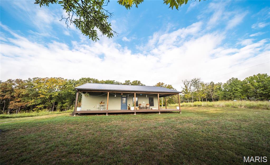 LOOKING FOR A QUIET ESCAPE? This charming 2 bed, 2 bath home sits on 7.7 acres of peaceful countryside and was built in 2022 with modern features throughout. Enjoy "on demand" hot water with a tankless system, plus the added bonus of a brand-new roof in 2024 for peace of mind. The property is ideal for a hobby farm or simply enjoying the outdoors with flat, usable land, three sheds and raised garden beds already in place. Conveniently located just 15 minutes from Owensville, Cuba, Sullivan, and Bourbon, you can enjoy rural serenity without sacrificing accessibility. The school district for K-8th grade is Strain-Japan R-XVI located in Sullivan. This property includes two parcels: 37-1-02.2-0-000-003.000 and 37-1-02.2-0-000-003.100.