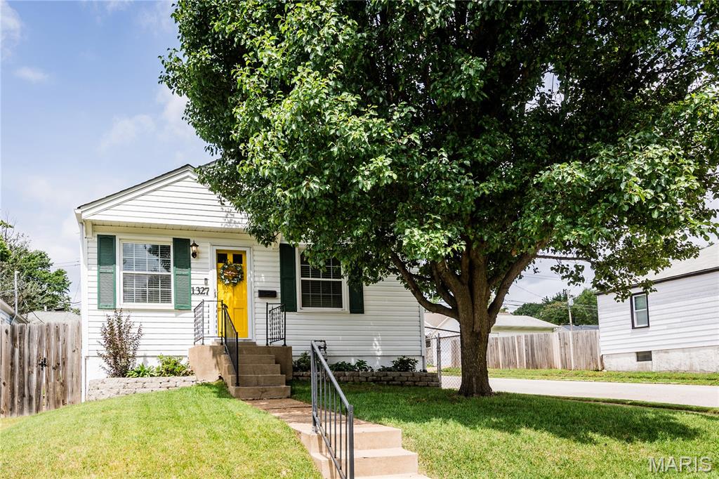 Welcome to 1327 Kraft Street, an incredibly well maintained, charming Dogtown (corner lot!) home that offers inviting indoor and outdoor living in one of St. Louis' most convenient and sought-after neighborhoods.

The backyard is a true extension of the home, featuring a fully fenced yard, mature landscaping, and a patio with pergola that creates the perfect setting for summer cookouts, evening gatherings, or a quiet morning coffee. It's an outdoor space that feels both private and welcoming.

Inside, you'll find comfortable living spaces filled with character and natural light. The partially finished basement provides valuable additional living space and includes one of the home's most unique features; a custom-built bar topped with thousands of hand-laid pennies and sealed to create a one-of-a-kind conversation piece. Whether you're hosting friends, watching the game, setting up a home office, or creating a playroom, this lower-level space offers tremendous flexibility.

A spacious, detached two-car garage is another rare find in Dogtown, providing convenient parking, storage, and workspace options that are difficult to come by in the neighborhood.

Located just minutes from Forest Park, Washington University, downtown Clayton, major hospitals, and many of St. Louis' favorite restaurants, coffee shops, and entertainment destinations, this location puts the best of the city within easy reach. Quick access to Highway 40/64 makes commuting simple while still allowing you to enjoy the charm and community feel that make Dogtown so desirable.

From the welcoming outdoor spaces to the unique custom touches inside, 1327 Kraft Street is a home full of personality, functionality, and opportunity in a location that's hard to beat. Come make this house your home.