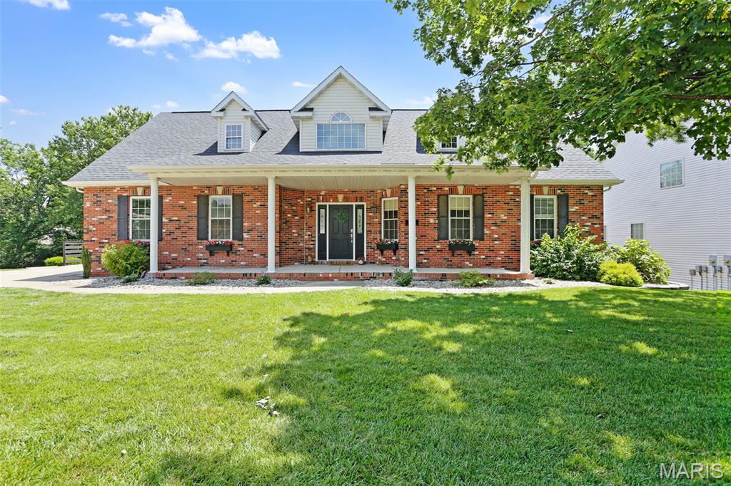 This Glen Carbon property is ready for its new owner! Located in the well-established Sturbridge neighborhood, this 4Bd/4Ba home with a walkout basement offers buyers a peaceful tree lined backyard while maintaining quick access to highways. The recent addition of a shared-use path along Glen Carbon Road provides Sturbridge residents a dedicated route to Schon Park thus connecting them to the broader MCT trail network throughout Madison County.
If parks and trails aren't your thing, maybe relaxing on the large, covered porch would interest you? Stretching almost the entire width of the home, the front porch is begging for rocking chairs and lemonade. Walk through the front door into the 2-story foyer with a dedicated office space just inside the French doors. This home offers another option for a workspace at the top of the stairs as well. The eat-in kitchen with stainless steel appliances has seating at the island in addition to space for a full dining table. When the weather allows, step outside and enjoy your morning coffee or a meal on the new composite deck (2026). The main floor primary has a double door entry and double the walk-in closets. The updated ensuite bath (2026) includes dual vanities, separate shower and inviting soaker bathtub. A second main floor bedroom is nearby along with a powder bath. 2 additional bedrooms are on the second level on either side of the catwalk overlooking the 2 story living room below. The basement level has a full bath and ample space to add an additional 5th bedroom. There is plenty of storage between the bonus room and utility garage which conveniently opens to the backyard for lawn equipment, etc. Extensive work was completed in 2023 in regard to landscaping & drainage of the front, back and sideyard. There's even a small creek and bridge to explore on the back of the parcel. Schedule a showing with your favorite realtor today and see this lovely home for yourself.