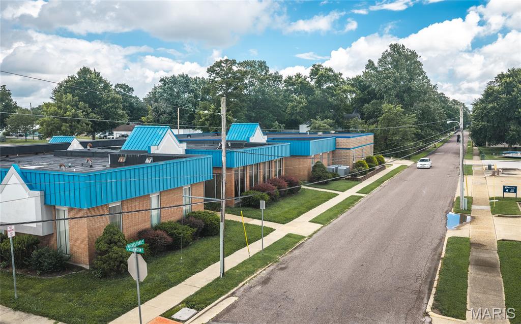 PRIME DOWNTOWN COMMERCIAL OPPORTUNITY — 27,204 SQ. FT. M/L!
Unlock the potential of this impressive 27,204 sq. ft. m/l commercial property, ideally located in the heart of downtown Sullivan. Offering an abundance of office space, a large paved parking lot, and a versatile layout, this property presents an exceptional opportunity for investors, business owners, developers, and entrepreneurs alike. The finished basement adds even more usable space and features a kitchen/commons area, additional offices, and bathrooms, creating endless possibilities for expansion, multiple businesses, professional services, organizational use, or redevelopment.
With its substantial square footage, flexible floor plan, downtown location, and generous parking, this property is ready to accommodate a wide variety of commercial uses. Bring your vision and bring an offer—opportunities of this size and versatility don't come along often!