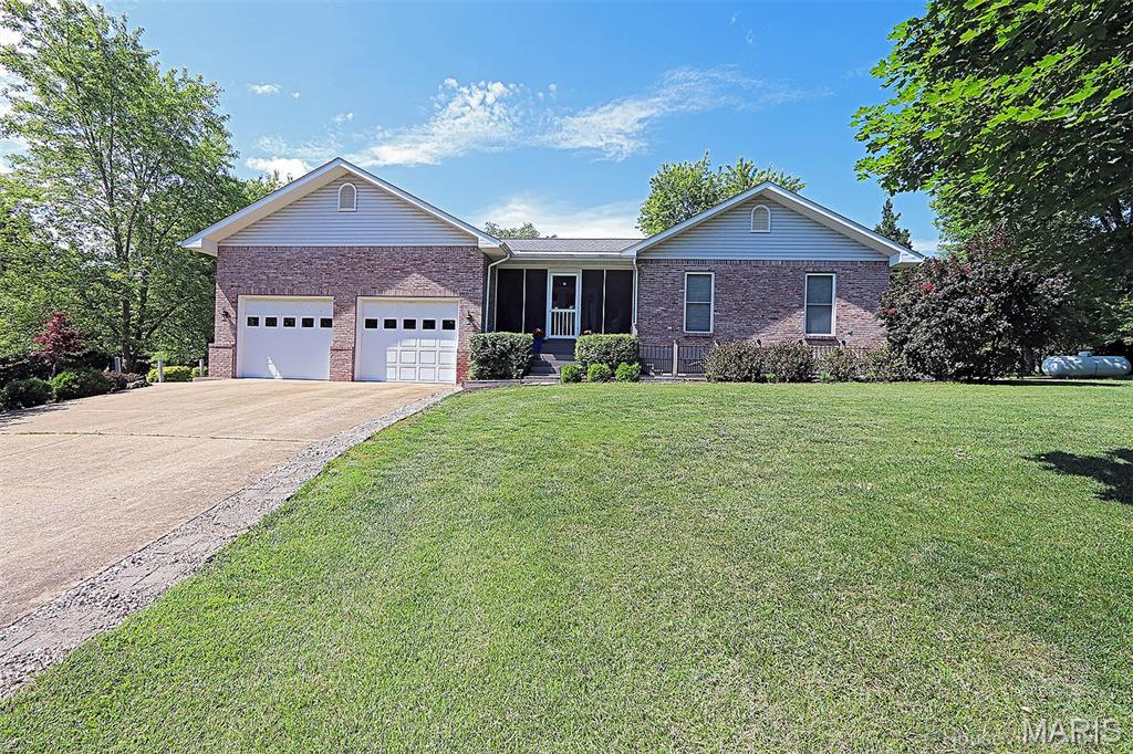 Discover a home crafted for modern living on 5 acres just outside Farmington. This single-family residence offers a harmonious blend of comfort and functionality in a park like setting. Must love wildlife to live here, deer and turkey are plentiful. The four bedroom and three full bathrooms ensure convenience and privacy, designed to accommodate the demands of daily routines with ease. Plenty of room in lower level for more bedrooms. Oversized 2 car attached garage plus a detached garage with shop. Also a huge carport for your camper.