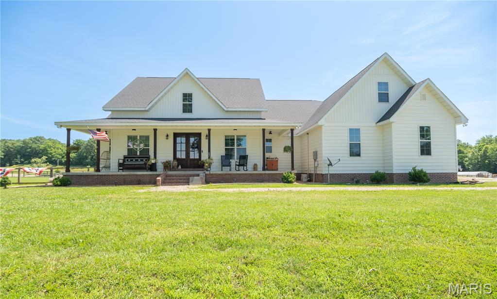 Welcome to 213 Puhicah Blvd., Puxico, Missouri - a custom-built family home that perfectly blends rustic elegance, quality craftsmanship, and timeless Southern charm. Situated on a spacious lot overlooking beautiful Arrowhead Lake, this remarkable property offers sweeping water views and stunning vistas of the surrounding pastures, rolling countryside, and abundant wildlife.

Designed with both comfort and durability in mind, this thoughtfully constructed home showcases sturdy craftsmanship and attention to detail throughout. The climate-controlled garage provides year-round convenience, while the home's inviting layout creates the perfect setting for family gatherings, entertaining guests, or simply enjoying peaceful lake living.

Step outside and experience the true beauty of the property from the expansive covered porches. Whether you're sipping morning coffee as the sun rises over the lake or unwinding in the evening while taking in breathtaking sunsets, these outdoor spaces offer a front-row seat to nature's daily display.

The generous lot provides ample room for outdoor recreation, including fishing right at your doorstep. Located just minutes from the amenities and recreational opportunities of Lake Wappapello, you'll enjoy easy access to boating, fishing, hiking, and year-round outdoor adventure. This exceptional property offers the perfect combination of scenic beauty, modern comfort, and relaxed lakeside living.