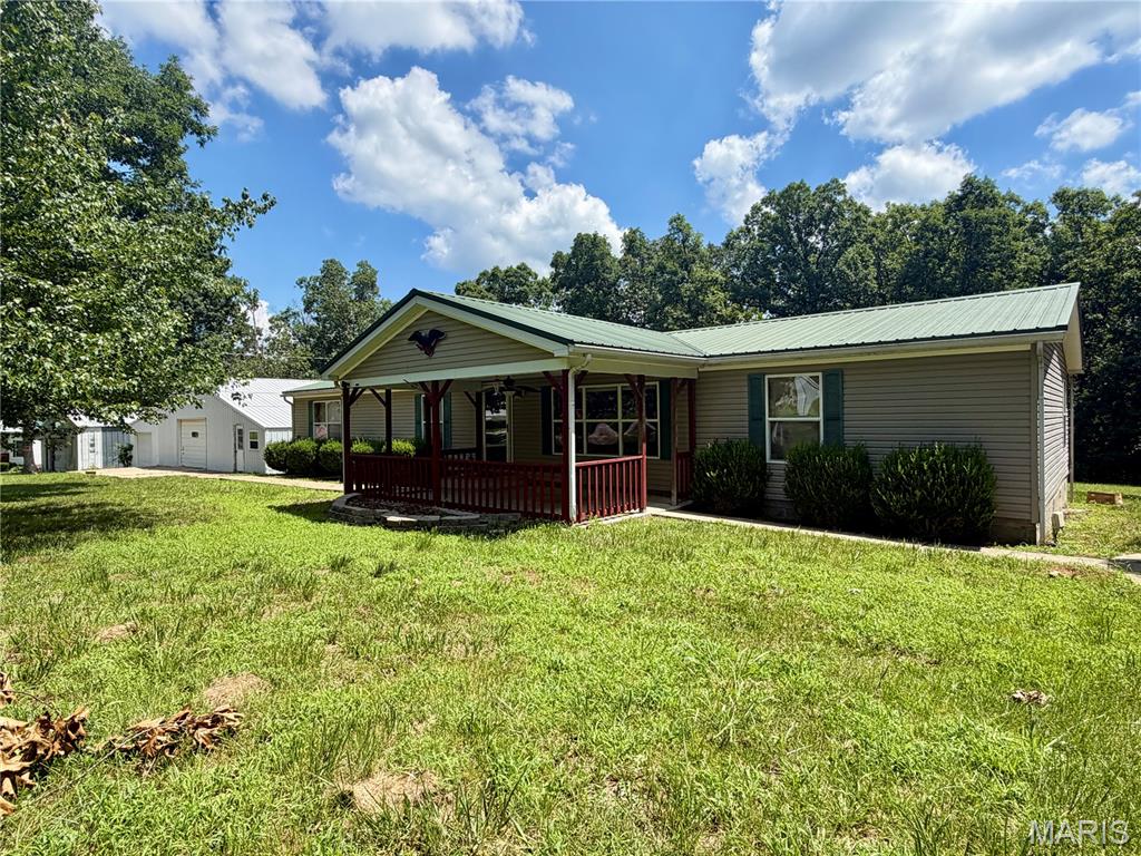 Great location and priced to sell, this property is full of potential! The 2001 Hart manufactured home offers 1,960 sq. ft. of spacious living with 3 bedrooms and 2 full bathrooms. Enjoy generously sized rooms, including both a living room and family room. The spacious kitchen features tons of cabinet space and a center island with bar seating. The large primary suite offers plenty of room to relax, along with an ensuite bath featuring a soaking tub and separate stand-up shower. The impressive 44x40 shop is a dream setup with endless possibilities for a mechanic shop, woodworking, detailing, auto refinishing, or more—even featuring a separate space designed for auto painting. Additional features include public water, a shared lagoon, central A/C, electric forced-air heat, and a carport for covered parking. Located in the Salem R-80 School District. Cash or conventional financing only. Property is being sold as-is.