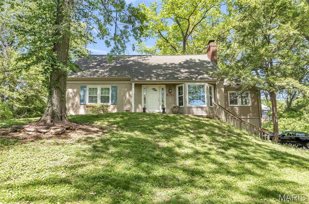 Don't miss the chance to make this charmer your new home. Tucked away on a private street and set on a rare half-acre lot, this 5 bedroom, 2.5-bath home blends classic character with thoughtful updates, including hardwood floors, charming moldings, a cozy fireplace, and a newly renovated kitchen.

The main floor features two bedrooms, full bath, living room, and a wonderful great room addition that creates extra space for everyday living and entertaining. Upstairs offers three additional bedrooms and a second full bath, while the half- finished lower level includes a large great room and half bath.

Outside, enjoy a serene, private backyard with a spacious deck, mature trees, and plenty of room to relax, play, garden, or entertain. A rare Kirkwood opportunity with charm, updates, space, and an incredible lot!