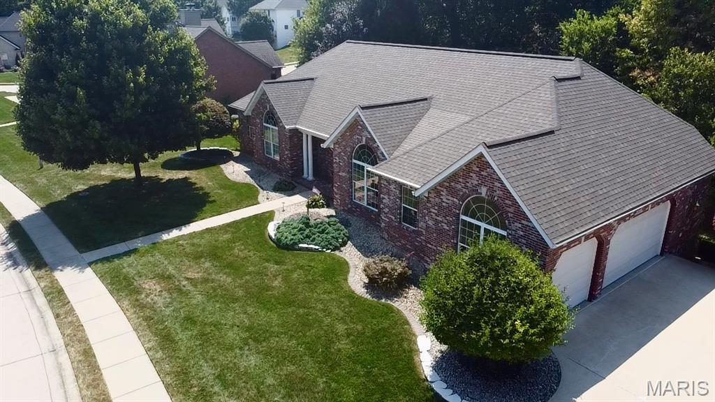 Welcome to this stunning 3-bedroom, 4-bath walkout ranch nestled in the desirable Fox Mill Estates! From the moment you step through the front door, you’ll be greeted by soaring ceilings, beautiful wood floors, and tall windows that fill the home with an abundance of natural light.

The spacious main level offers an inviting living room with a cozy fireplace and an impressive kitchen featuring an abundance of cabinetry and appliances that stay with the home. The large main-level laundry room is a dream, complete with a sink and plenty of additional cabinetry for storage.

The spacious primary suite offers a private retreat with its own ensuite bathroom featuring a separate shower and relaxing jetted tub. Additional bedrooms and baths provide plenty of space for family and guests.

The finished walkout lower level expands the living space with a large family room centered around a second fireplace, a second kitchen, built-in bar, and an abundance of storage. This versatile level is perfect for entertaining, extended family, guests, or additional living space.

Step outside and enjoy the beautifully wooded backdrop from the back deck and multiple patio areas. The backyard backs to trees, providing a peaceful and private setting. The hot tub stays, making the outdoor space ready for relaxation and entertaining.

A spacious 3-car garage provides plenty of room for vehicles, toys, and additional storage. With its beautiful finishes, generous living spaces, exceptional storage, multiple entertaining areas, and serene wooded setting, this Fox Mill Estates ranch is a must see!
