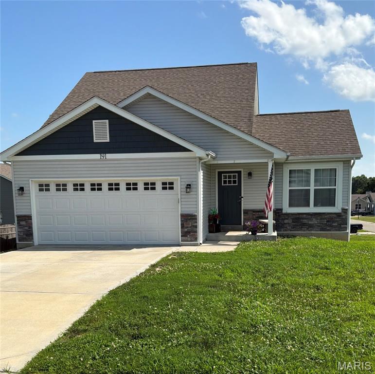 Welcome home to this beautifully maintained 6-year-old home in Winfield, located in a wonderful neighborhood! This charming one-and-a-half-story home offers fantastic curb appeal and sits proudly on a spacious corner lot.

Step inside and immediately notice the gorgeous flooring and abundance of natural light flowing throughout the home. The stunning kitchen features a large center island, upgraded tall white cabinetry, stainless steel appliances, and plenty of space for entertaining and everyday living.

The main-floor primary suite is conveniently located just off the kitchen and includes a walk-in closet with optional laundry hookups, while an additional laundry area is also available on the upper level. Upstairs, you’ll find two more spacious bedrooms, both complete with walk-in closets, along with a full hall bathroom.

The walkout lower level offers endless potential with large windows and a rough-in bath, making it the perfect space to create additional living areas tailored to your needs and enhanced with a large patio, professional grading, landscaping improvements, and a stylish backsplash.

Don’t miss this incredible opportunity to own a move-in-ready home with modern finishes, thoughtful updates, and plenty of room to grow!
