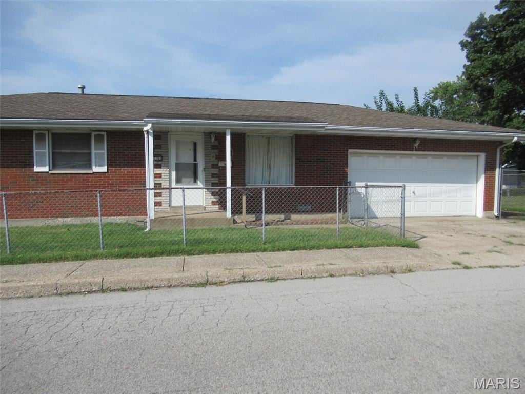 Well loved full brick home is ready for the next chapter. This home features a good size living room for relaxing or entertaining.  The eat-in kitchen has oak cabinets with lots of storage and a snack bar. There is space for a table for family meals.  All appliances stay with the home.  The hall bath has an extra tall toilet along with a tub/shower and a big linen closet for storage. The front bedroom is a nice size and has a double closet.   The back two bedrooms have an adjoining 1/2 bath.  At the end of the hall there is a closet with additional shelving.  The original hardwood floors are still in tact under some of the carpet.   The house is on a corner lot and there is a large covered deck at the side of the house along with a fully fenced in yard. The deck has been newly painted and is ready to be enjoyed.  The attached two car garage opens to the kitchen and also has a nice work area with plenty of shelves. Contact your favorite agent and schedule a showing!