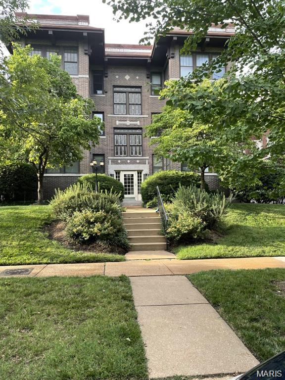 An impeccable historic condominium located within walking distance to all Forest Park has to offer, as well as The Loop, Metro Link and the Central West End. Superbly landscaped grounds and tree lined streets welcome you home to your new neighborhood. Upon entering your secured building, you will encounter captivating stained glass throughout the hallway. Inside the unit you will immediately be inspired by the countless bespoke finishes. Vast wood floors, built in bookcases, exposed brick, and unique light fixtures, French doors, a sun porch, and a fireplace are just the beginning of all the unique touches this home has to offer. The kitchen awaits with its modern stainless appliances (including newer refrigerator, gas stove and plenty of room to entertain. Adjacent to the kitchen you will find the washer and dryer and tons of storage. Private gated parking in the rear. Pets are negotiable. Location: Ground Level