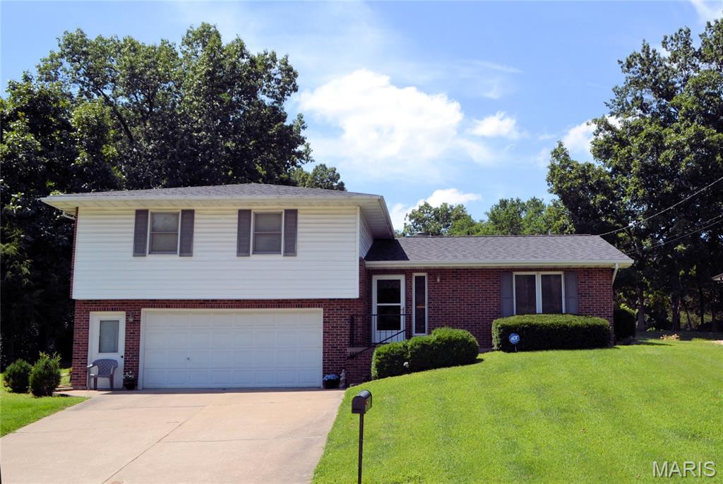 MOTIVATED SELLER! Well maintained 3-bedroom, 3 full bath, tri-level home on double lot on quiet dead-end street is now available. In recent years updates include a new roof, 2025 hot water heater, furnace & central air. Entry has shining parquet floor. The remainder of the main flooring has new luxury durable vinyl flooring. New wood flooring in stairways & hall installed 2025 Kitchen has oak cabinets & pantry. Some appliances and water softener stay.  Refrigerator & washer dryer are negotiable. Dining area leads to French doors and courtyard. Relax in the family area next to the office or possible 4th bdrm with pocket doors. The ground level garage enters into the laundry room and a full bath. Upper level has 2 bdrms and full bath. Primary 3rd bdrm offers double closets and full bath.  The large backyard is partially fenced backing up to tree line. The 2 sheds convey and have water spicket and electric.