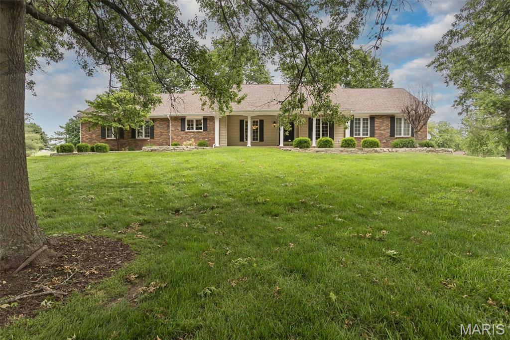 Welcome to this beautiful ranch home in the highly sought-after Dardenne Farms community of Cottleville! Offering over 4,000 square feet of living space, on 3.5 acres, this home combines generous room sizes, thoughtful design, and a wonderful location. From the moment you arrive, you’ll be impressed by the outstanding curb appeal. Inside, the welcoming foyer is flanked by a private office and elegant formal dining room—perfect for working from home or hosting family and friends. The vaulted great room is truly a showstopper, featuring beautiful wood beams, a cozy fireplace, and doors that open to an expansive patio, creating a seamless flow for indoor and outdoor living. The kitchen offers custom cabinetry, a breakfast bar, and plenty of space for preparing meals and gathering with loved ones. The spacious primary suite is a true retreat, complete with a large walk-in closet and a luxurious spa-like bath featuring dual vanities, a soaking tub, and a separate shower. The finished lower level provides even more living space with a large family and recreation area, wet bar, bonus room, full bath, and abundant storage. Step outside and enjoy your own private backyard retreat. Located in a golf cart-friendly community and just minutes from parks, shopping, and dining in charming Cottleville, this home offers the perfect combination of style, space, and convenience. Showings start on May 28th. Open house  Friday, May 29th from 4:30pm-6:30pm Love where you live!