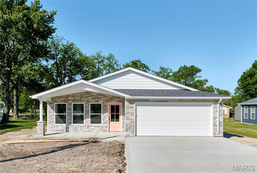 Welcome to 113 N Illinois Street , a beautifully built new construction home offering modern finishes, functional living space, and small-town charm in the heart of New Florence. With 3 bedrooms, 2 full bathrooms, and over 1,100 square feet of thoughtfully designed living space, this move-in-ready ranch combines style, comfort, and convenience all on one level. Step inside to an open-concept floor plan filled with natural light, luxury vinyl plank flooring, and clean contemporary finishes throughout. The spacious living area flows seamlessly into the kitchen, creating the perfect setup for both everyday living and entertaining. The kitchen features white cabinetry, stainless steel appliances, granite countertops, a large center island with stone accents, and plenty of workspace and storage. The private primary suite offers a spacious bedroom, walk-in closet, and beautifully finished bathroom complete with dual vanities and a custom tiled shower. Two additional bedrooms provide flexibility for guests, family, or a home office, while the second full bath features updated modern finishes. You’ll also appreciate the oversized laundry and utility room with added storage space and functionality. Additional highlights include an attached 2-car garage, covered front porch, covered back patio, low-maintenance exterior, and public utilities. The level lot offers plenty of outdoor potential to make the space your own. Located in the Montgomery County R-II School District with easy access to Interstate 70, this brand-new home offers the perfect opportunity to enjoy modern living in a quiet community setting.