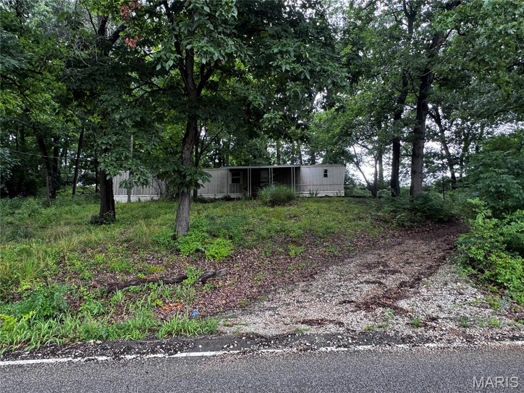 Check out this large 1.1 Acre property, located right across from Konert Lake Estate. Public Water!! Septic in working condition. Possible access to public sewer, may be possible to subdivide with rezoning. Be part of a community without the subdivision restrictions. Mobile home on property is included at $0 value. Mobile home has water damage to the flooring and some walls, currently not safe to enter. Access with accepted contract. Great location near schools, shopping and restaurants.