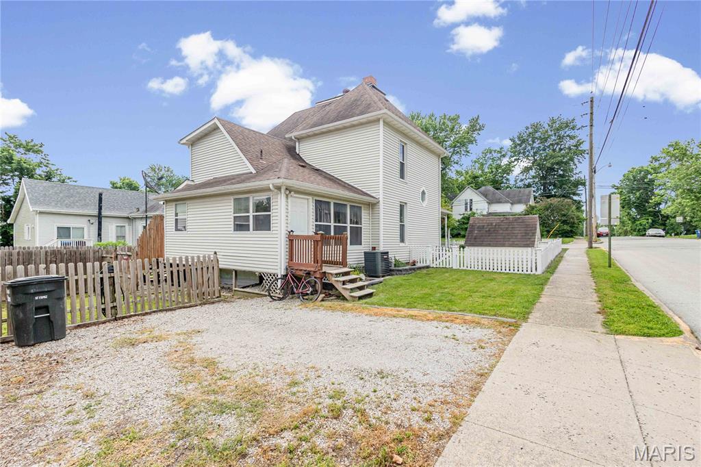 Nestled in a prime location near the historic downtown Brick District of Fulton, Missouri, this charming 2 story, 4-bedroom, 2-bathroom home is full of character and convenience. Built in 1900, the original floorplan has been thoughtfully updated to improve functionality and maximize space, including a full-sized basement with outside access and professional waterproofing. White crown molding throughout the interior creates a warm, open, and inviting atmosphere.
The spacious main floor layout features an open-concept kitchen, dining room, and living room…perfect for gatherings and entertainment. A wood-burning stove adds a cozy touch to the living room, while the main level master bedroom and bathroom offer easy accessibility and comfort. Upstairs, the bedrooms are generously sized, with one featuring a walk-in closet for ample storage.
Outdoor living is equally appealing, with a covered entryway and a white picket fence framing the front yard with a cozy matching pet home that’s ready for you to customize. Out back, a privacy fence, concrete patio, and raised garden beds create a serene and secluded retreat.
The location is truly unmatched. Within walking distance of both Westminster and William Woods Universities, and just minutes from the Brick District's local favorites including: Brooklyn Pizza, Bek's Restaurant, Saults Pharmacy Soda Fountain, McIntire's Florist, the Callaway County Library, and more. Major employers nearby include Fulton Public Schools, Westminster and William Woods Universities, Fulton State Hospital, Hitachi Energy, Ameren Missouri Callaway Energy Center, and the Missouri School for the Deaf. For those looking beyond Fulton, Columbia is just 25 miles west, offering an expanded job market anchored by the University of Missouri and MU Health Care. 25 miles from Jefferson City and 20 miles from Whetstone Conservation Area, Auxvasse, MO. 

Prospective buyers, please ensure you have a preapproval letter or proof of funds ready before scheduling a showing. Buyer to verify all measurements and online data.