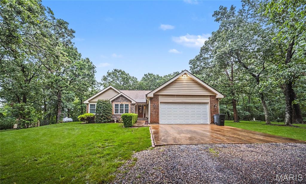 SPECTACULAR MOVE IN READY HOME!. This one is a must see. Home is updated throughout . Very spacious with 4 bedrooms and 3 full baths, Home has cathedral ceilings with open soffit and planter shelving, granite counter tops, engineered hardwood flooring and ceramic tile.  Master bedroom has a walkin shower with 2 water heads and a bench seat,, a large vanity and walk in closet with built in cabinetry. There are french doors going to the deck from master . Full walk out basement has a family room, wet bar area, large bedroom with its own full bath and 2 storage rooms.  there is an awesome 33 x 13 deck with a a 11 x 6 covered deck, and a pergola. A 2 car attached garage that  is 25 ft deep and fits a full size SUV. Outside the yard is beautifully landscaped with flower beds , a basketball court, playground area, and a very nice shed for storage and a dog pen. COME SEE THIS ONE. YOU WON'T BE DISAPPOINTED!!