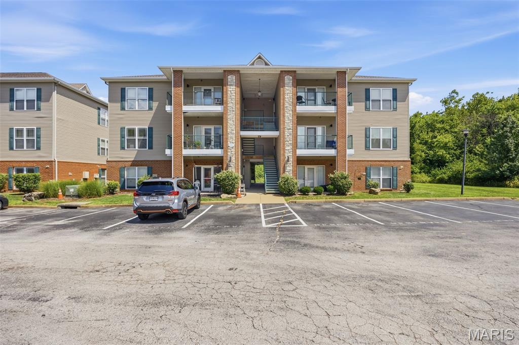 Enjoy easy, one-level living in this inviting first-floor Valley Park condo with no steps and beautiful, private views. The open-concept kitchen flows seamlessly into the living room, where sliding glass doors provide a peaceful outlook and lead to a private outdoor patio. A convenient storage closet on the patio adds valuable extra space. The spacious primary bedroom features a lovely tree-lined view and a private full bath. A second bedroom and additional full bath provide flexibility for guests, an office, or everyday living. The in-unit laundry room offers added convenience along with extra storage, and the washer and dryer stay with the home. Neutral decor and flooring create a warm, move-in-ready feel, while the included appliances make the transition easy. Located in a convenient and sought-after Valley Park location, this condo offers comfortable living, privacy, beautiful views, and exceptional convenience—all on one level.
