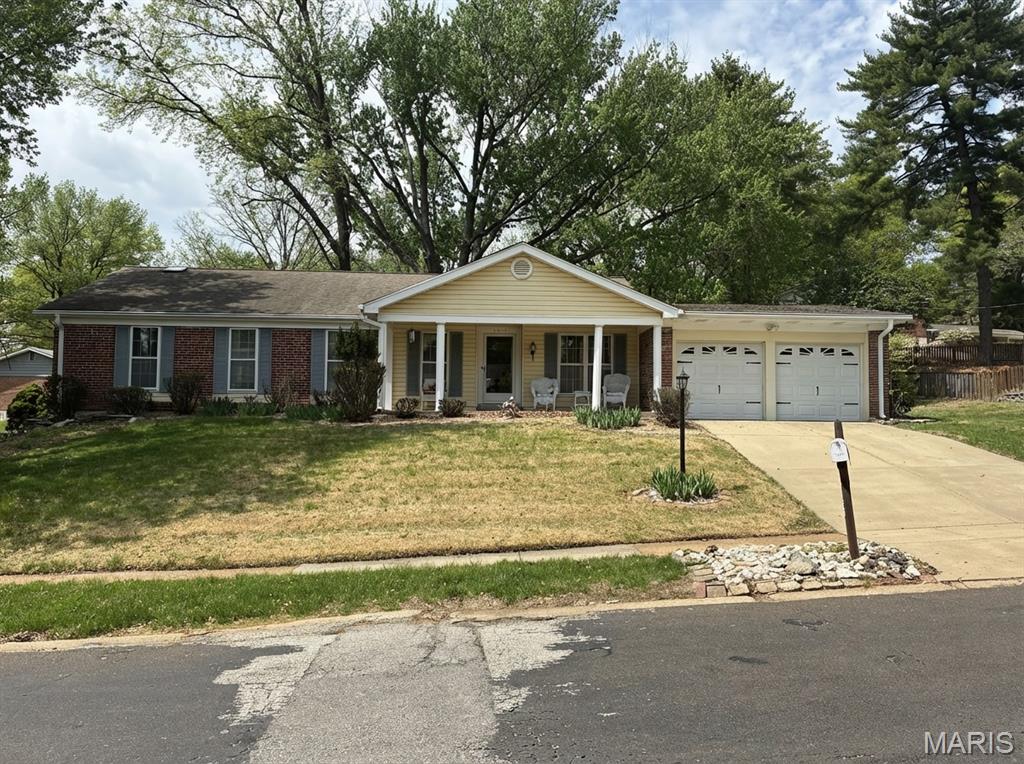 Welcome to this impressive ranch home nestled in the sought-after Old Farm Estates community, offering over 3,000 square feet of finished living space. A charming covered front porch sets the tone as you step into a welcoming entry foyer flanked by a formal dining room and formal living room — perfect for entertaining.

The heart of the home features a spacious family room with a cozy wood-burning fireplace, flowing seamlessly into a generous eat-in kitchen. Down the hall, the private primary suite boasts a walk-in closet and a roll-in accessible shower, accompanied by three additional well-sized bedrooms — all on the main floor.

The lower level exudes character and versatility, anchored by an expansive 32x31 recreation room with endless possibilities. A second large finished room adapts easily to a home gym, office, or additional sleeping space.

Major mechanicals have been thoughtfully updated — including the roof, HVAC, water heater, and driveway, all approximately 10 years old — plus an updated 200-amp electrical panel for peace of mind.

Step outside to your private backyard retreat, complete with a patio, covered side patio, and beautiful mature shade trees. Located in the Parkway School District and just a short stroll from the Old Farm Pool, this home offers the best of community living.

Solidly built with timeless character, this home is ready for its next family to put their personal touch on it and truly make it their own!