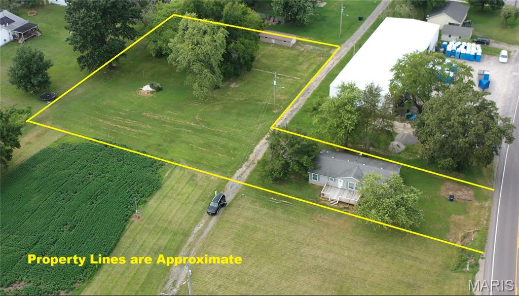 3 bedrooms and 2 bath 1999 mfg. home in Willisville, IL.  Perry County. Large living room, eat-in kitchen and spacious bedrooms.  Newer 12X24 front deck.  Storage shed 10X12.  Home is on a lot that adjoins an additional 0.6 Ac lot that lays flat and has electric, water and gas available.   The lot includes a 13X20 block building with 9X6.5 overhead door.  Plenty of space for all of your outdoor activities.