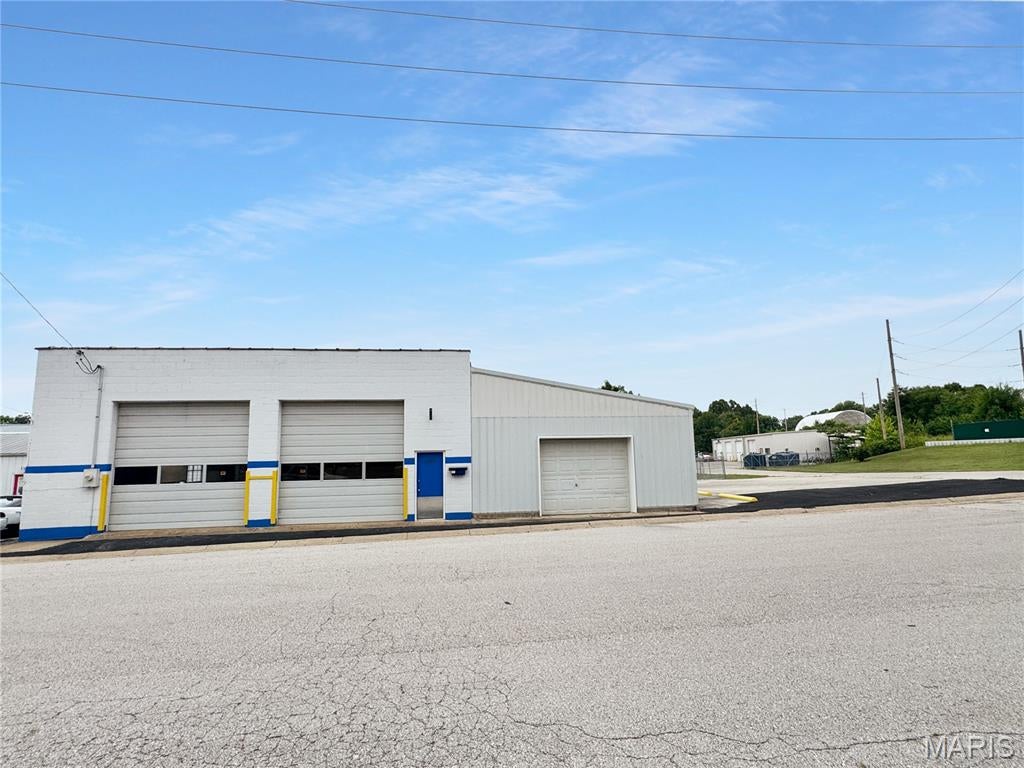 Opportuniity for your own a building with 3 garage doors 12X12 ft garages for your own  Car repair, Detailing, Storage vehicles, and so much more. 2 2 offices with HVAC, 1 bath could add shower if want to convert to living space. 25 parking spots for vehicles and fenced, 6 additional parking spaces and on-street parking. Does have an additional building that is rented at $200 per month off the alley.  Has 3 air compressors lines, steel workbench with lighting and electric, and a spot for a lift if needed. This property has so much to offer. Come see!