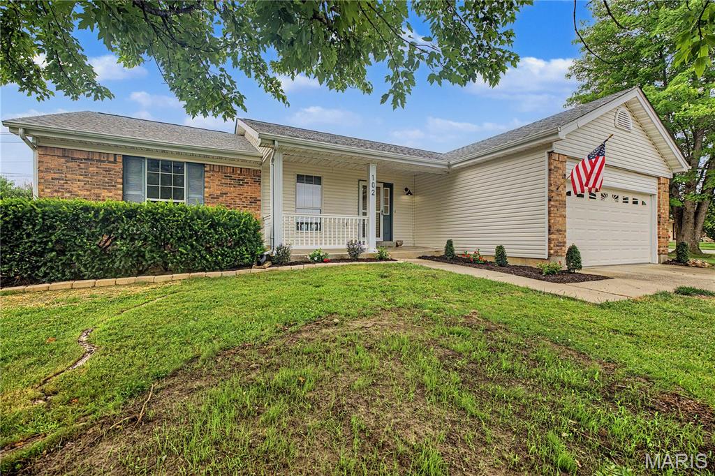 Welcome to your new home at 102 Rockaway Drive! This beautifully updated home features a spacious open floor plan with stunning luxury vinyl plank flooring throughout the main level. The inviting family room boasts a vaulted ceilings, recessed lighting, and a cozy wood-burning fireplace, creating the perfect space to relax or entertain. The brand-new kitchen is a true showstopper, offering custom cabinetry, elegant quartz countertops, a breakfast bar, and stainless steel appliances. The adjoining dining area seamlessly connects the kitchen and family room, providing an ideal layout for gatherings with family and friends. The main level also includes three generously sized bedrooms, two fully renovated bathrooms, and a convenient laundry area just off the kitchen. The finished lower level expands your living space with a massive recreation room, a fourth sleeping room, a third full bathroom, and plenty of additional storage. Outside, you'll enjoy a charming covered front porch, a two-car attached garage, and a level backyard featuring a brand-new concrete patio—perfect for outdoor entertaining. This move-in-ready home truly has it all. Don't miss your opportunity to make it yours—showings begin Thursday, July 9!